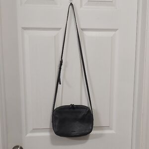 Compact Black Pebbled Leather Crossbody Bag With Adustable Strap And Double Zip